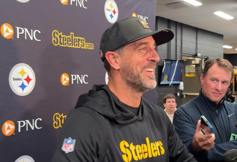 Aaron Rodgers laughing in locker room