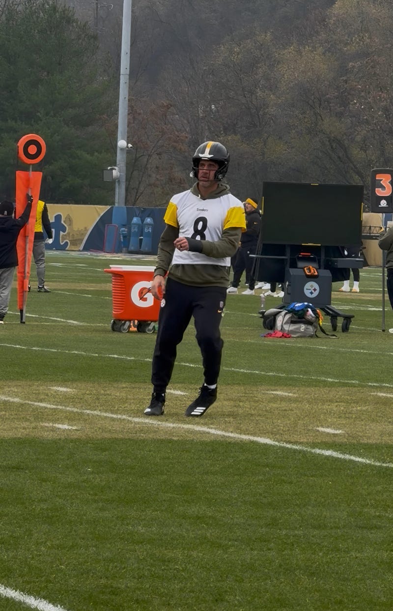 Aaron Rodgers on the field with a brace