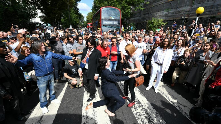Beatles Fans Flock to 'Abbey Road' Crosswalk on 50th Anniversary of Iconic Photo