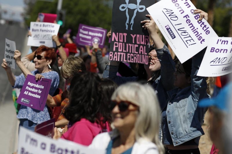 People rally in support of abortion rights, May 21, 2019, in Las Vegas.