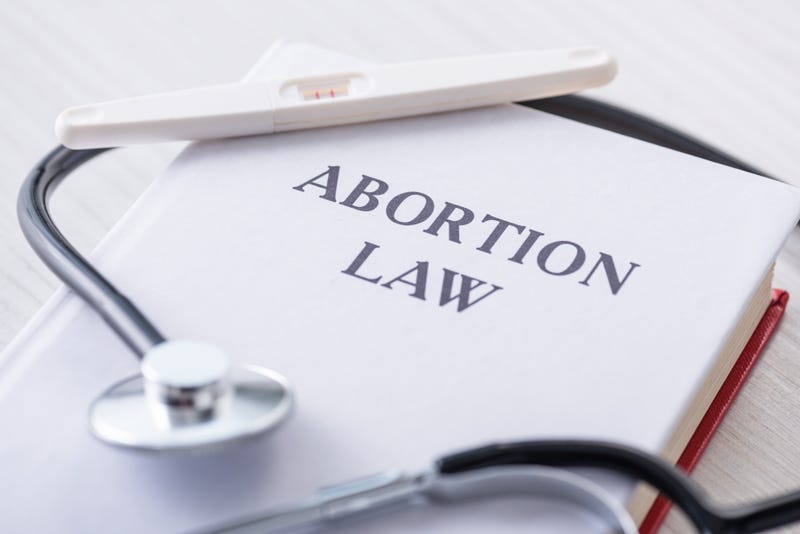 A book on abortion law, with a stethoscope sitting atop