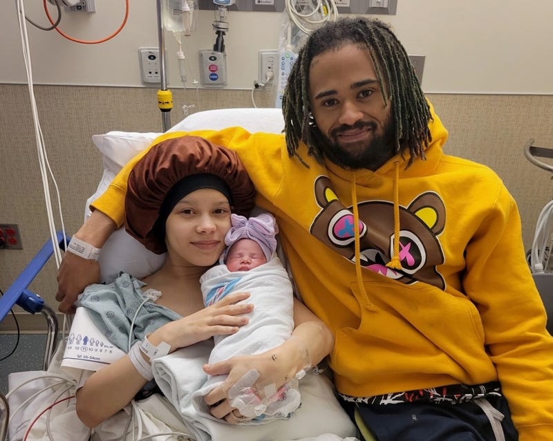 Parents Kiara and Robert Rhodes with baby Rue, born on Jan. 1, 2024, at 5:05 a.m.