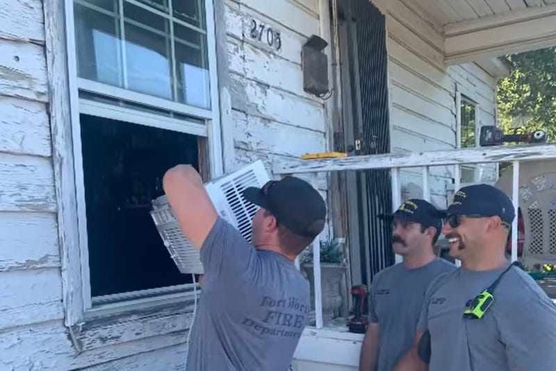 First responders install a free air conditioner for an elderly Fort Worth woman