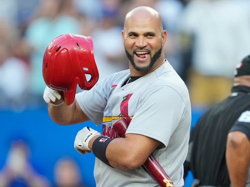 Albert Pujols #5 of the St. Louis Cardinals tips his helmet to the crowd in a break against the Toronto Blue Jays in the first inning during their MLB game at the Rogers Centre on July 26, 2022 in Toronto, Ontario, Canada. 