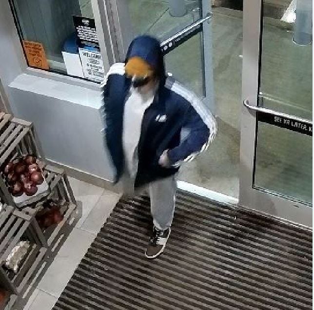 The suspect entering Alltown Fresh.