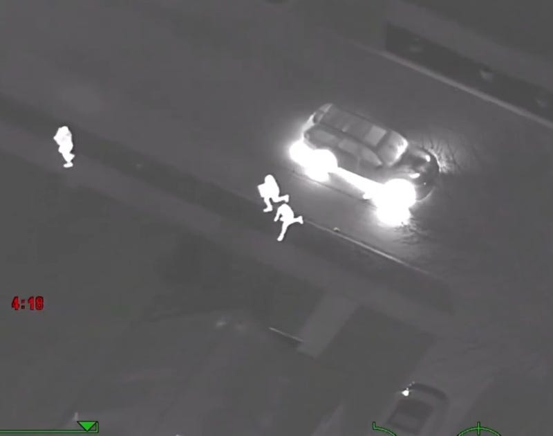 Suspects running from SUV
