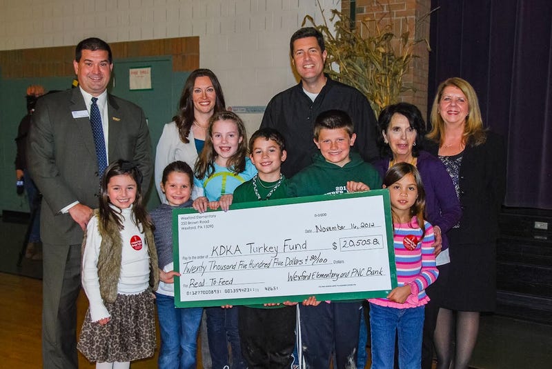 Andy Swartout and Luke Shanahan presenting check to KDKA Turkey Fund