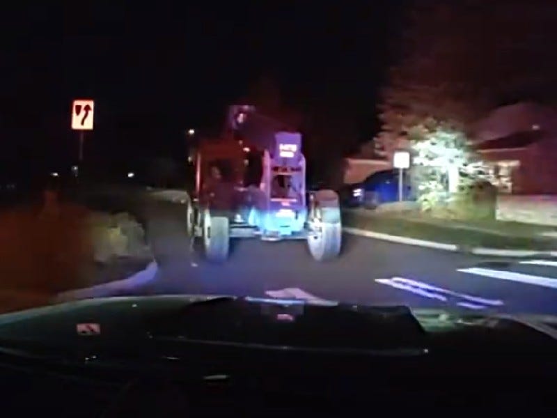 Dash camera footage shows 12-year-old boy leading police on chase in stolen forklift in Ann Arbor neighborhood.
