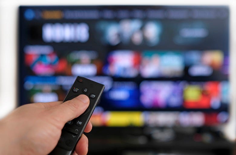 remote control in front of smart TV
