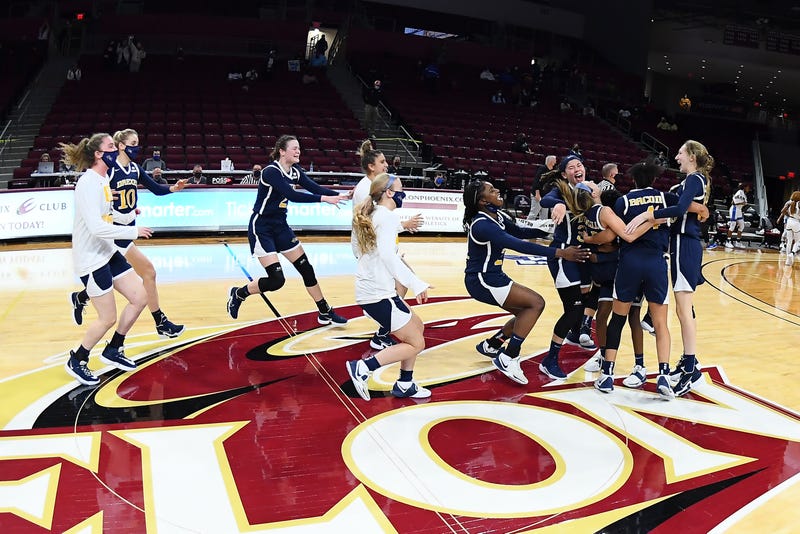 The Drexel women's basketball team celebrates its CAA title.