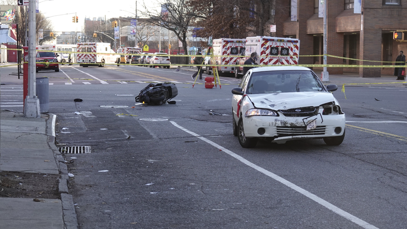 Three people were hospitalized after a car collided with a moped in East New York, Brooklyn on Tuesday morning.