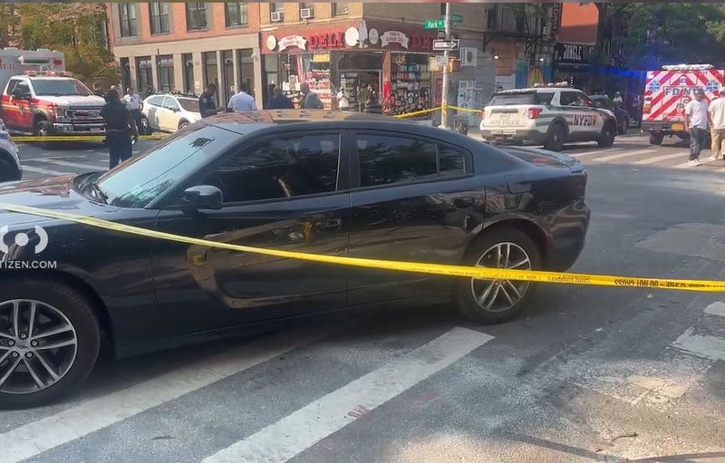 Police investigate after two men were shot outside of a Crown Heights deli on Wednesday afternoon.