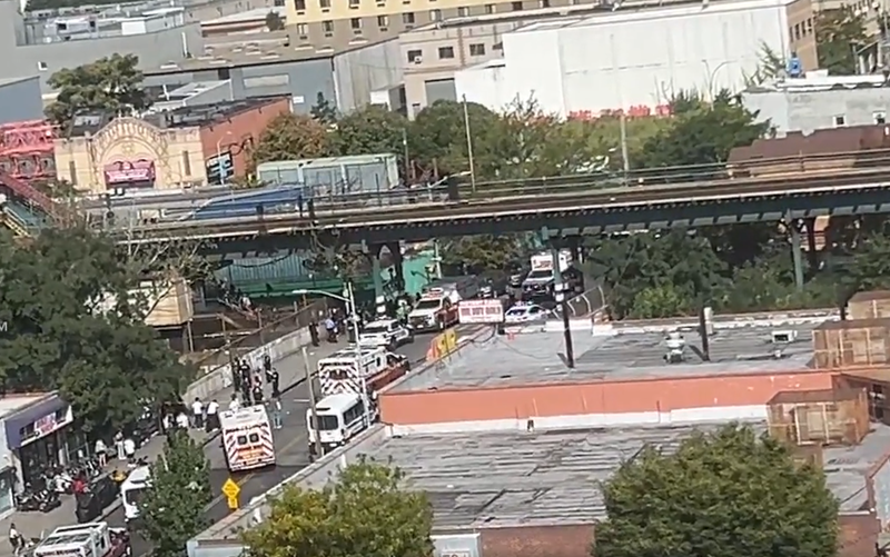 Officials respond after at least four people, including at least one officer, were injured in a Brooklyn subway station shooting on Sunday afternoon.