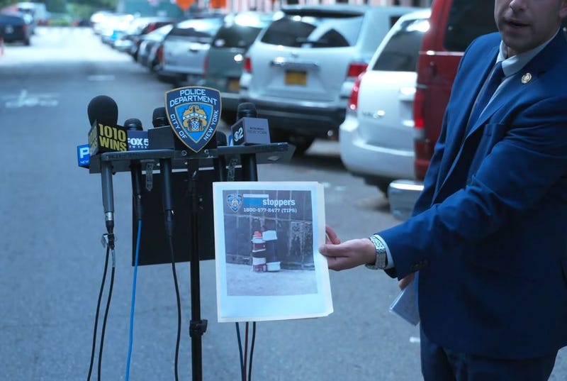 The NYPD Bomb Squad responds to the 25th Precinct in Manhattan after an "explosive device" was found on the sidewalk.