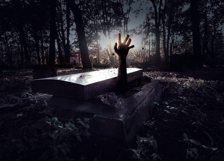 hand reaching out of coffin