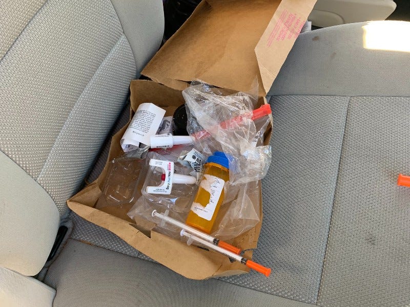 Drug paraphernalia in back seat of suspects' car