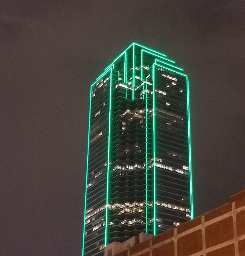 The Dallas City Council has approved an economic development agreement with a group that plans to make improvements to the Bank of America tower downtown.