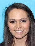 Danielle Banzet.  Last seen wearing a long red/white dress with glasses and has long blonde hair (dyed after the DL picture)