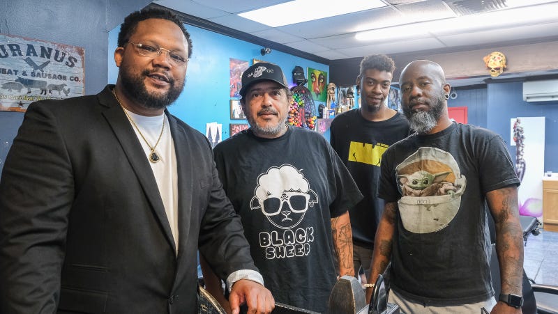 Tyce Combs knows all the business owners on his block in Upper Darby. He's pictured with Rick Colon, Mathieu Maddox and Tony Raysor of Ink Slingas Tattoo.