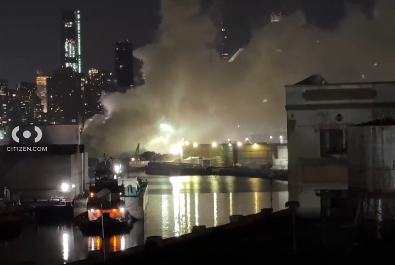 A barge caught fire on Newtown Creek on Tuesday night, sending smoke over LIC