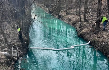 Booms placed Wednesday in the Bear Creek Drain at the direction of the Macomb County Public Works Office.