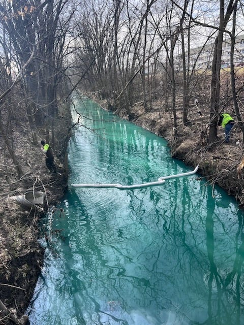 Booms placed Wednesday in the Bear Creek Drain at the direction of the Macomb County Public Works Office.