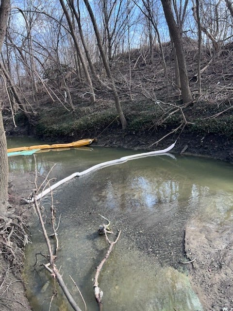 Booms placed Wednesday in the Bear Creek Drain at the direction of the Macomb County Public Works Office.