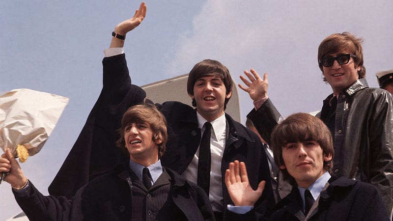 2nd July 1964: The Beatles, John Lennon, George Harrison (1943 - 2001), Paul McCartney and Ringo Starr, pictured on their arrival in London following a tour of Australia.