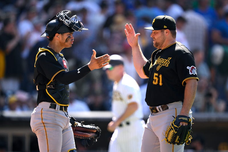 David Bednar and Endy Rodriguez celebrate after defeating the Padres