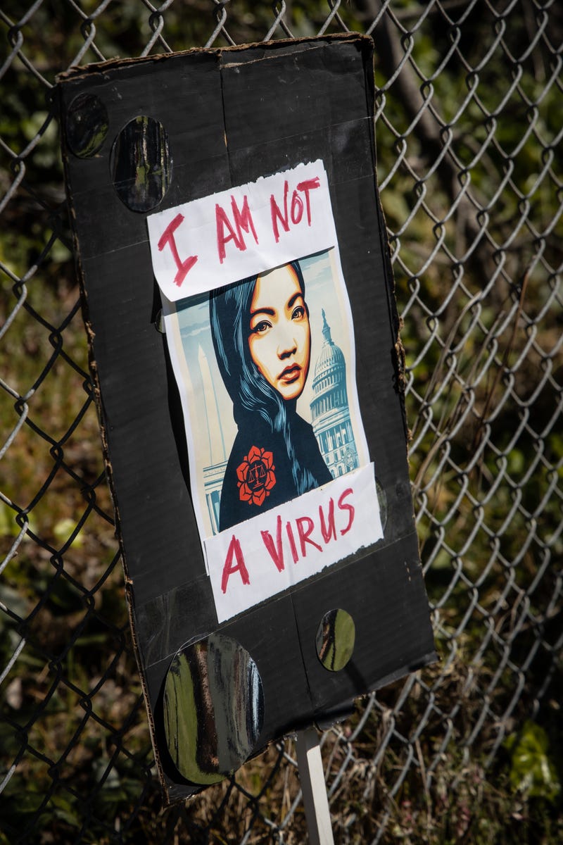 Hundreds of people rally in Berkeley, to show support for the Asian American community.