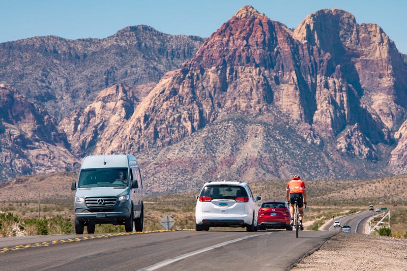 A biker shares the road with vehicle traffic