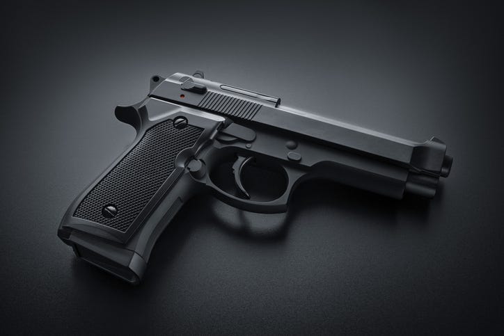 Black handgun on black bacground