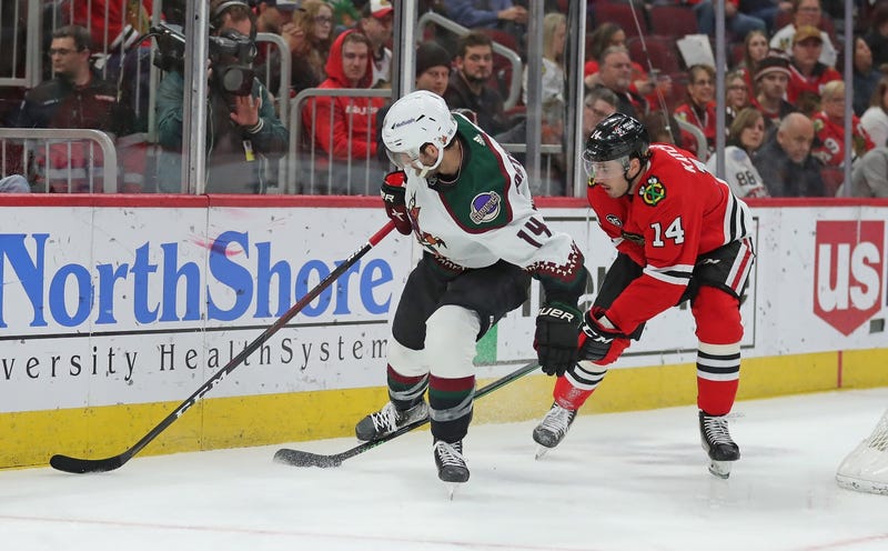 Blackhawks left wing Boris Katchouk (14) steals the puck from Coyotes defenseman Shayne Gostisbehere (14).