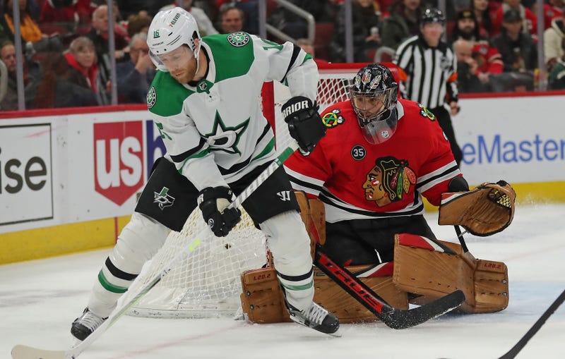 Stars center Joe Pavelski (16) skates with the puck in front of Blackhawks goaltender Marc-Andre Fleury (29).