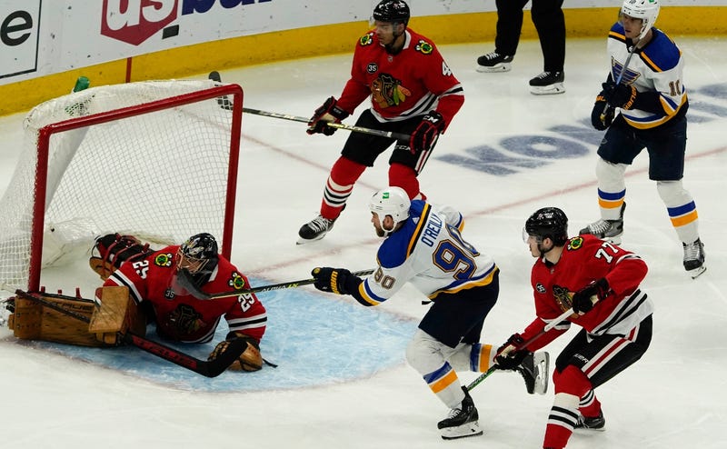 Blackhawks goaltender Marc-Andre Fleury (29) makes a stop on Blues center Ryan O'Reilly (90).