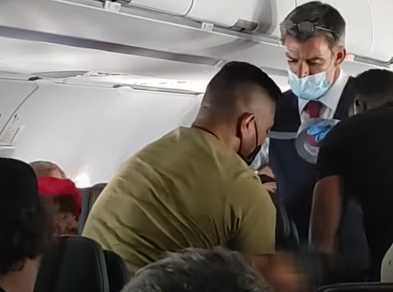 Flight attendant duct taping kid