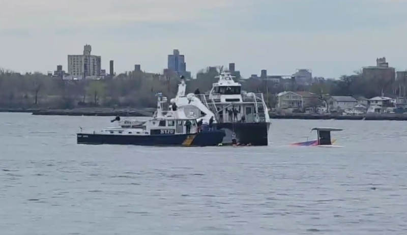 Members of the NYPD Harbor Unit rescue four people who were in the East River after their boat capsized on Sunday afternoon.