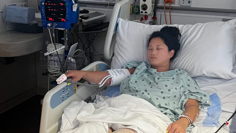 Woman on a hospital bed