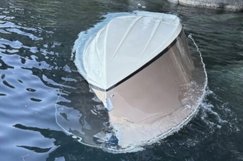In the photo released by the U.S. Coast Guard, a capsized vessel floats is seen near D.L. Bliss State Park at Lake Tahoe, Calif., June 21, 2025.