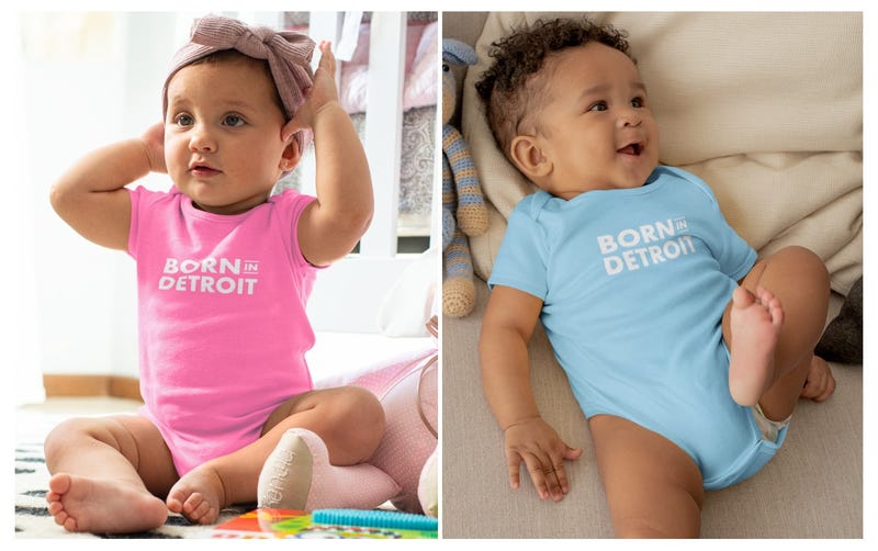 Pink and blue onesies with Born in Detroit logo