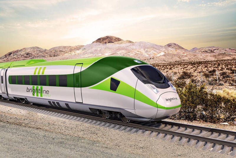 A high speed rail train moves through the desert southwest