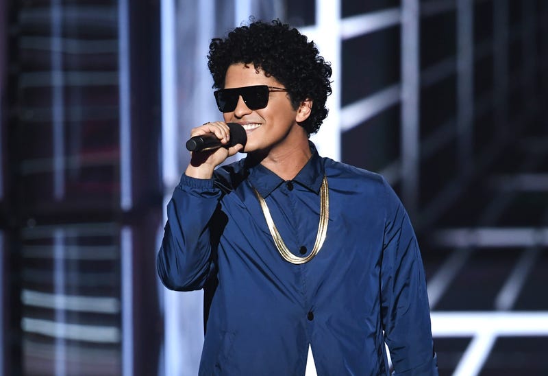 Bruno Mars speaks onstage during the 2018 Billboard Music Awards at MGM Grand Garden Arena on May 20, 2018 in Las Vegas, Nevada