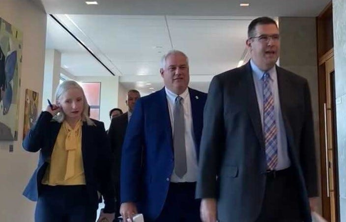 Gregg Shore (right) will be demoted from his first assistant district attorney post after being caught driving for food delivery service DoorDash during his office hours.