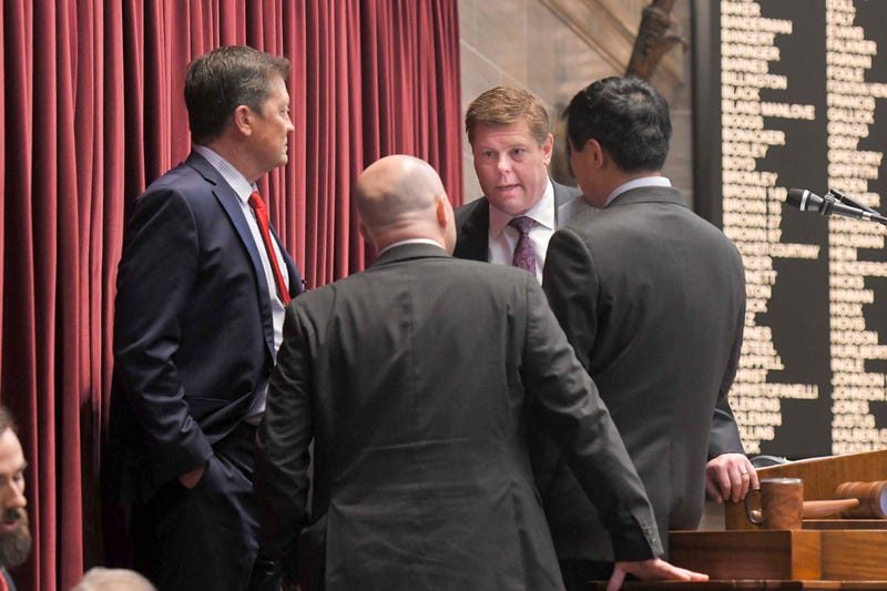 House Speaker Dean Plocher, R-Des Peres, center, speaks with, from left, Speaker Pro tem Mike Henderson, R-Bonne Terre, Budget Committee Chairman Cody Smith, R-Carthage, and Majority Leader Jonathan Patterson, R-Lees Summit, during a March debate on the state budget on March 30, 2023.