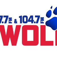 107.7 and 104.7 The Wolf logo