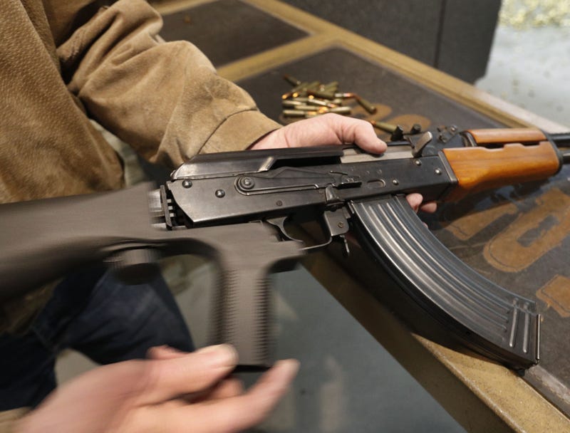A bump stock is installed on an AK-47 and its movement is demonstrated at Good Guys Gun and Range on February 21, 2018 in Orem, Utah.