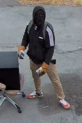 Surveillance snapshot of a serial burglar wanted by Las Vegas Metro Police and the FBI