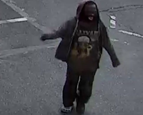 A suspect, pictured in a surveillance image above, is wanted for punching and spitting on an on-duty MTA bus driver on Saturday.