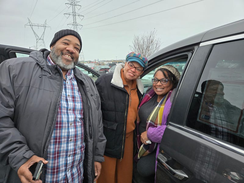 Catherine and Jervis White, founders of Black Roots Sauces & Seasonings, with Sheletta Brundidge (center) and their new van.