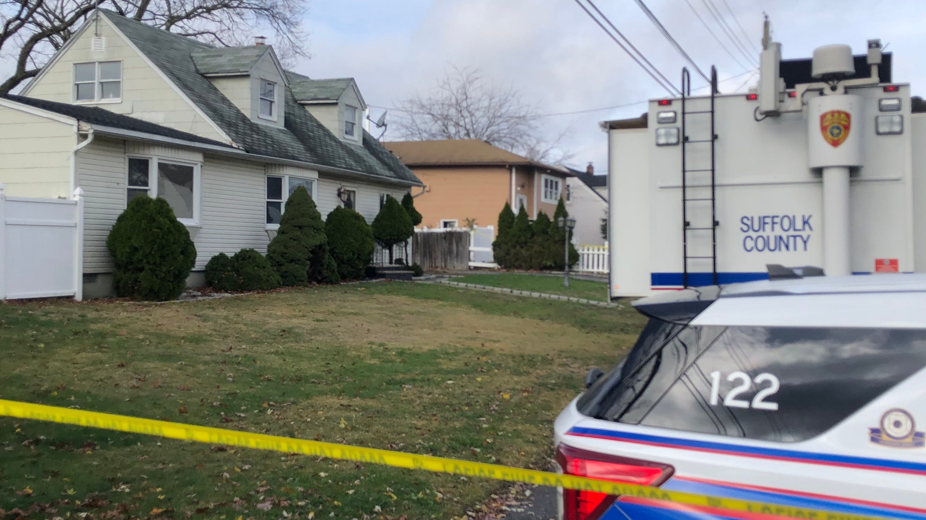 Son found 'covered in blood' outside LI home after stabbing mom to death with knife